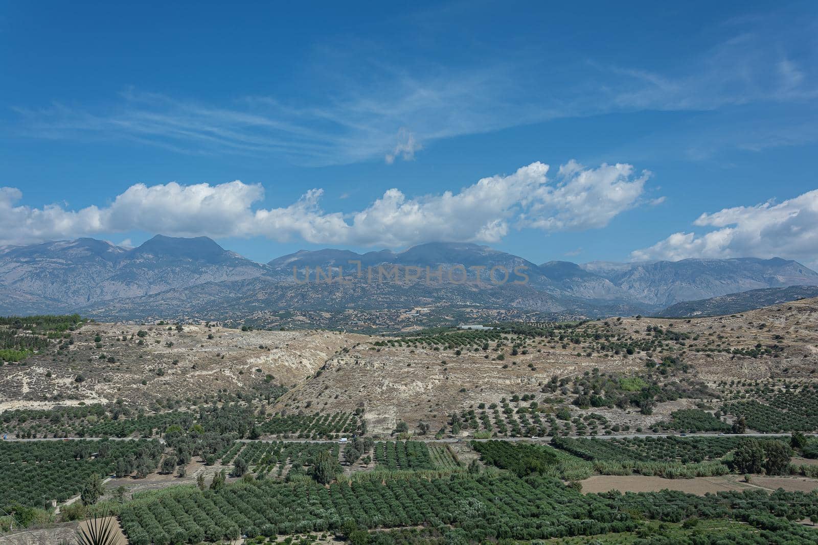 Mountain landscape. Valley in the foothills and mountain range. Stock photo