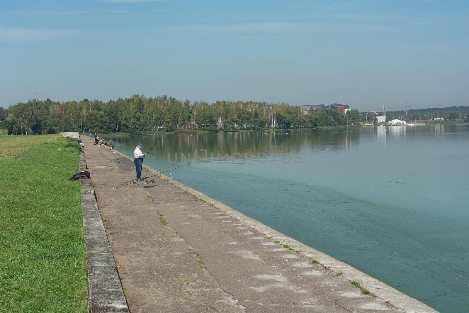 Minsk, Belarus - 09/12/2019: Fish on the river embankment fishing by Grommik