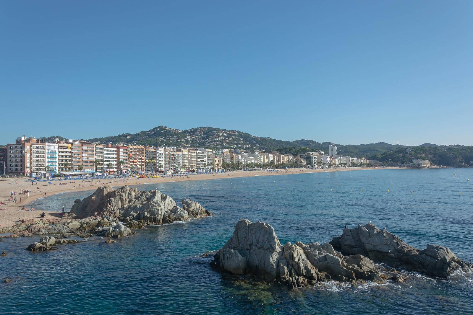 Lloret De Mar, Spain - 10/02/2019: city beach and promenade by Grommik