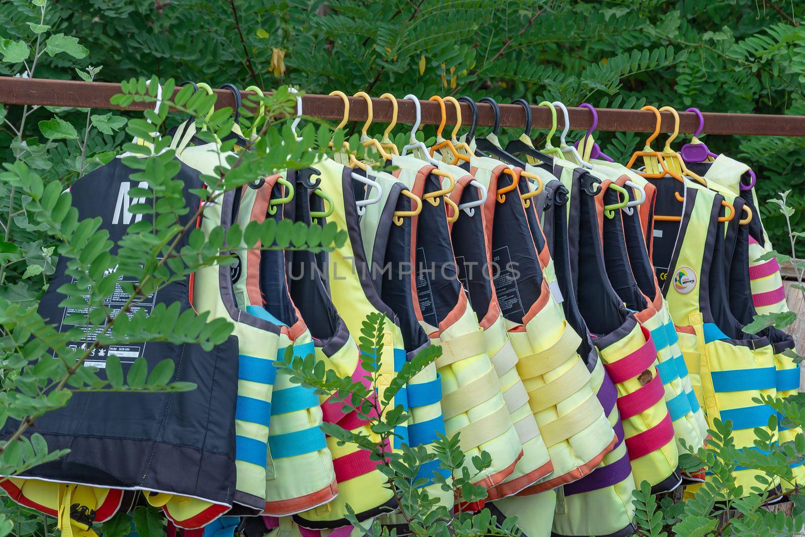 Sozopol, Bulgaria - 09/06/2018: Life jackets hang on a hanger. Stock photo.