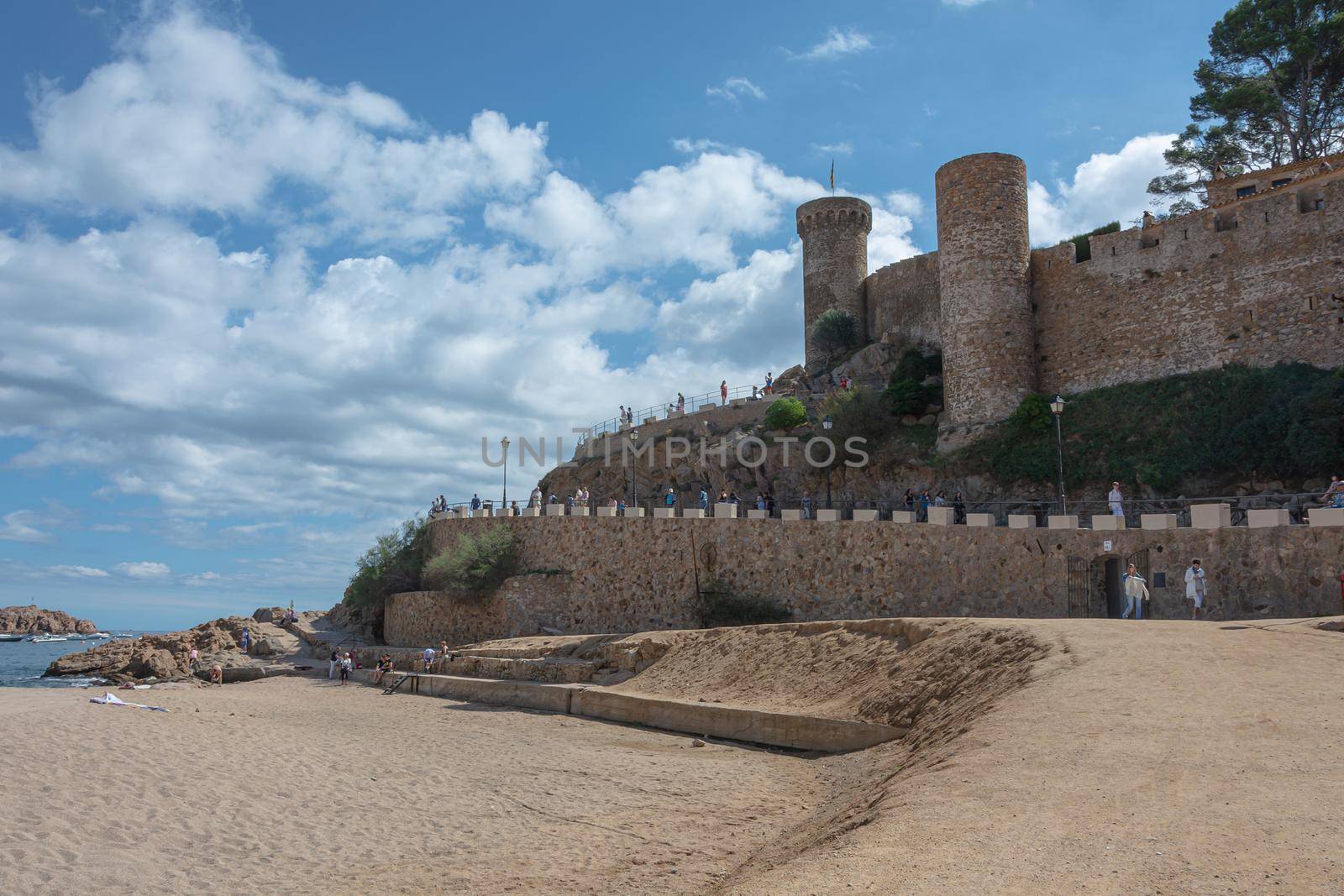 Tossa, Spain - 09/19/2017: old fortress on the sandy beach. Stock photo