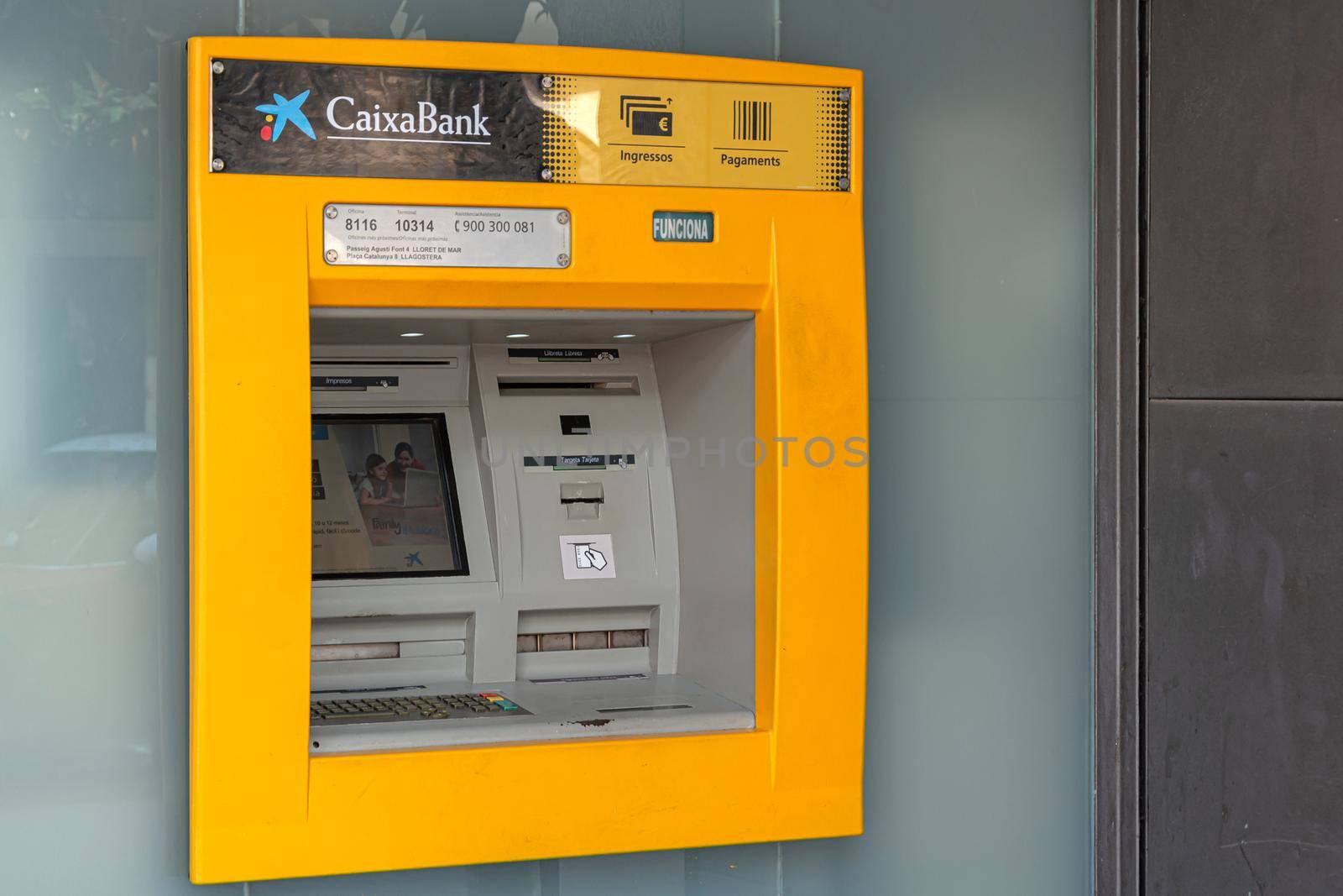 Tossa, Spain - 09/19/2017: through the Wall ATM for cash withdrawal. Stock photo.