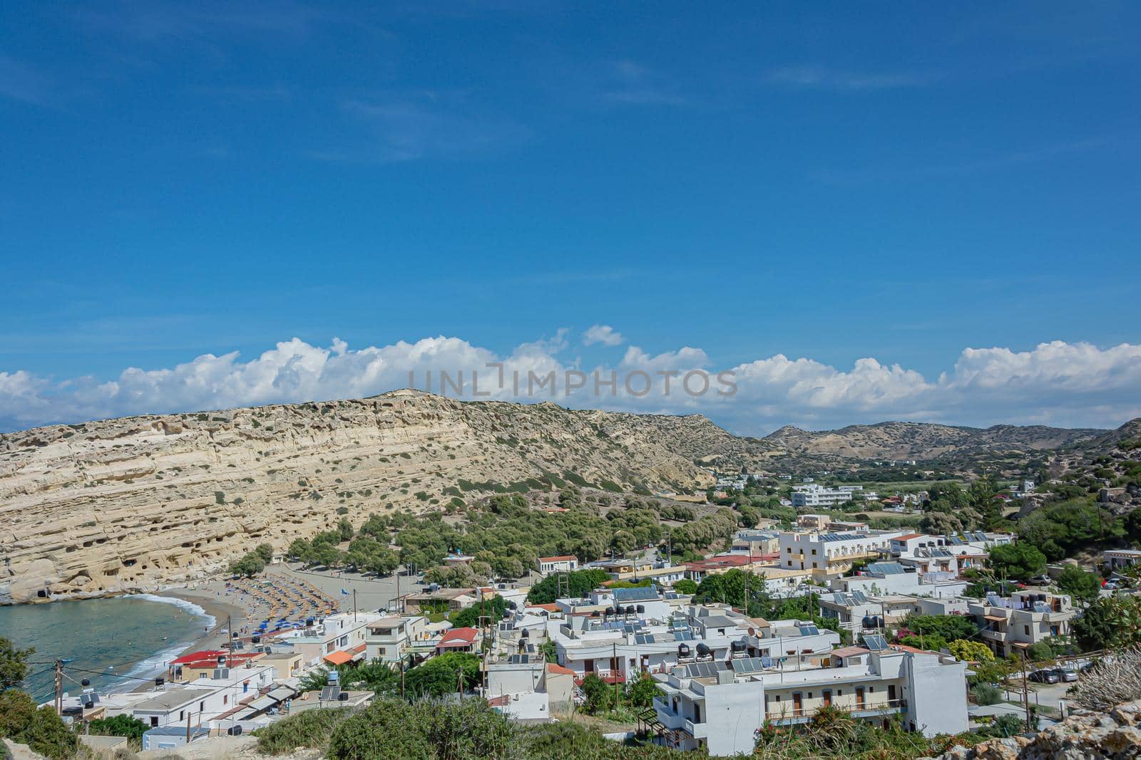 Seascape. Coastline and beach of the resort of Matara (Crete, Greece). Stock photo.