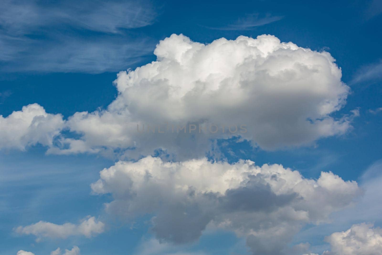 Cumulus clouds in the sky. Stock photo for creative design and backgrounds