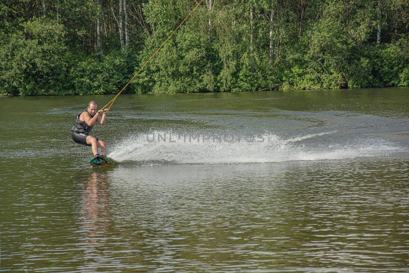 Belarus, Minsk - 07/09/2016: Training of an athlete on a kitesurf simulator by Grommik