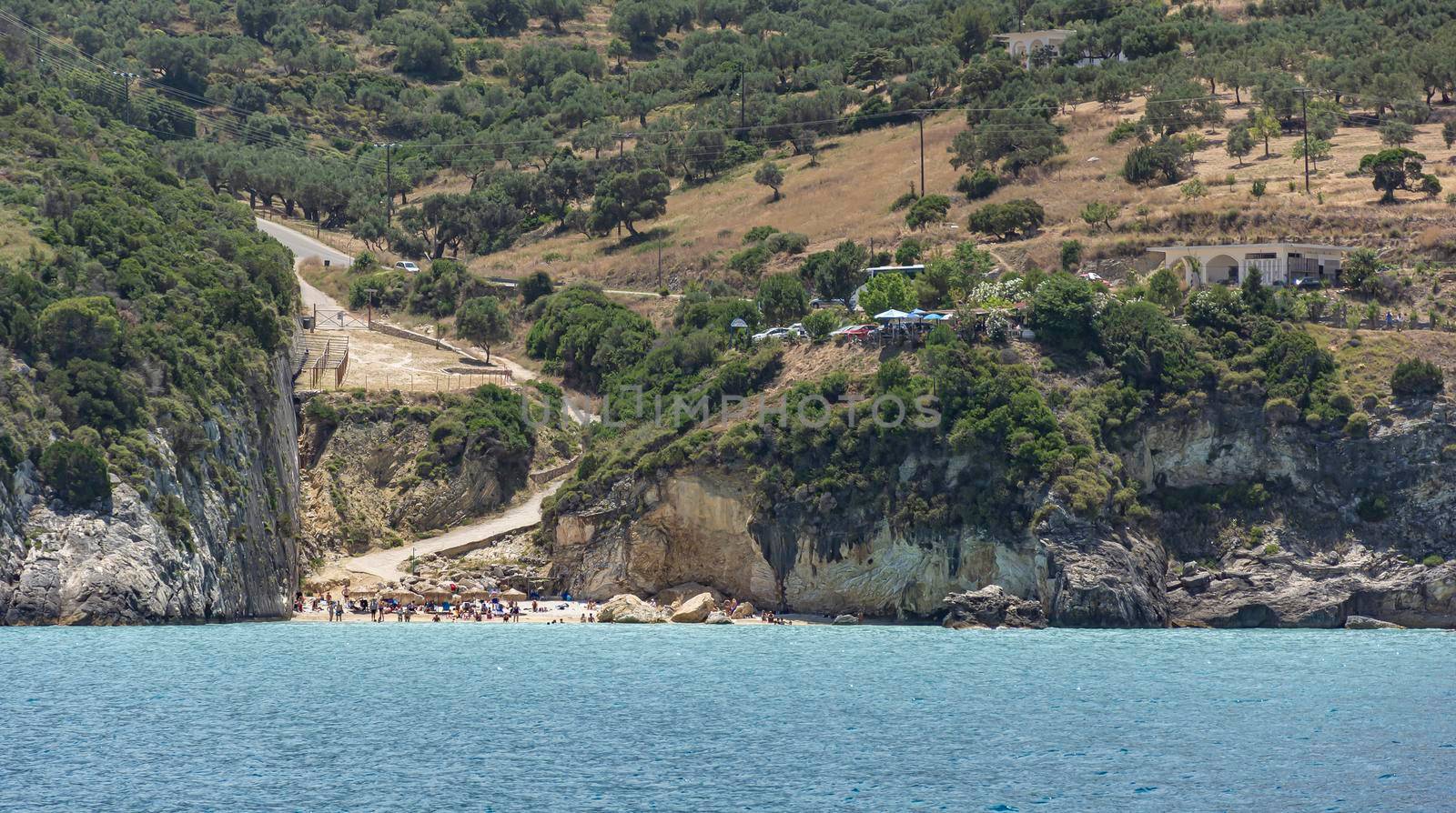 seascape. A small beach in a crevice between the coastal rocks. Color stock photo (Xigia Beach, Greece, Zakynthos Island)