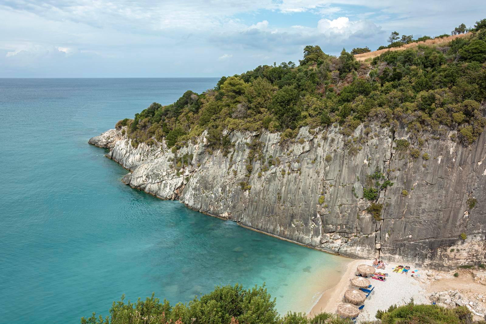 seascape. A small beach in a crevice between the coastal rocks. Color stock photo (Xigia Beach, Greece, Zakynthos Island)