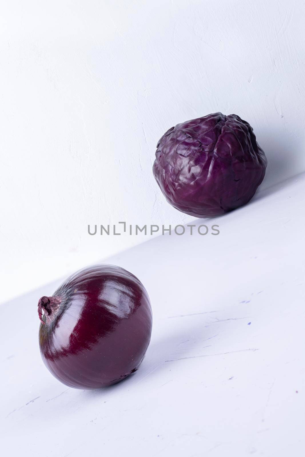 purple cabbage and onions on purple and white.