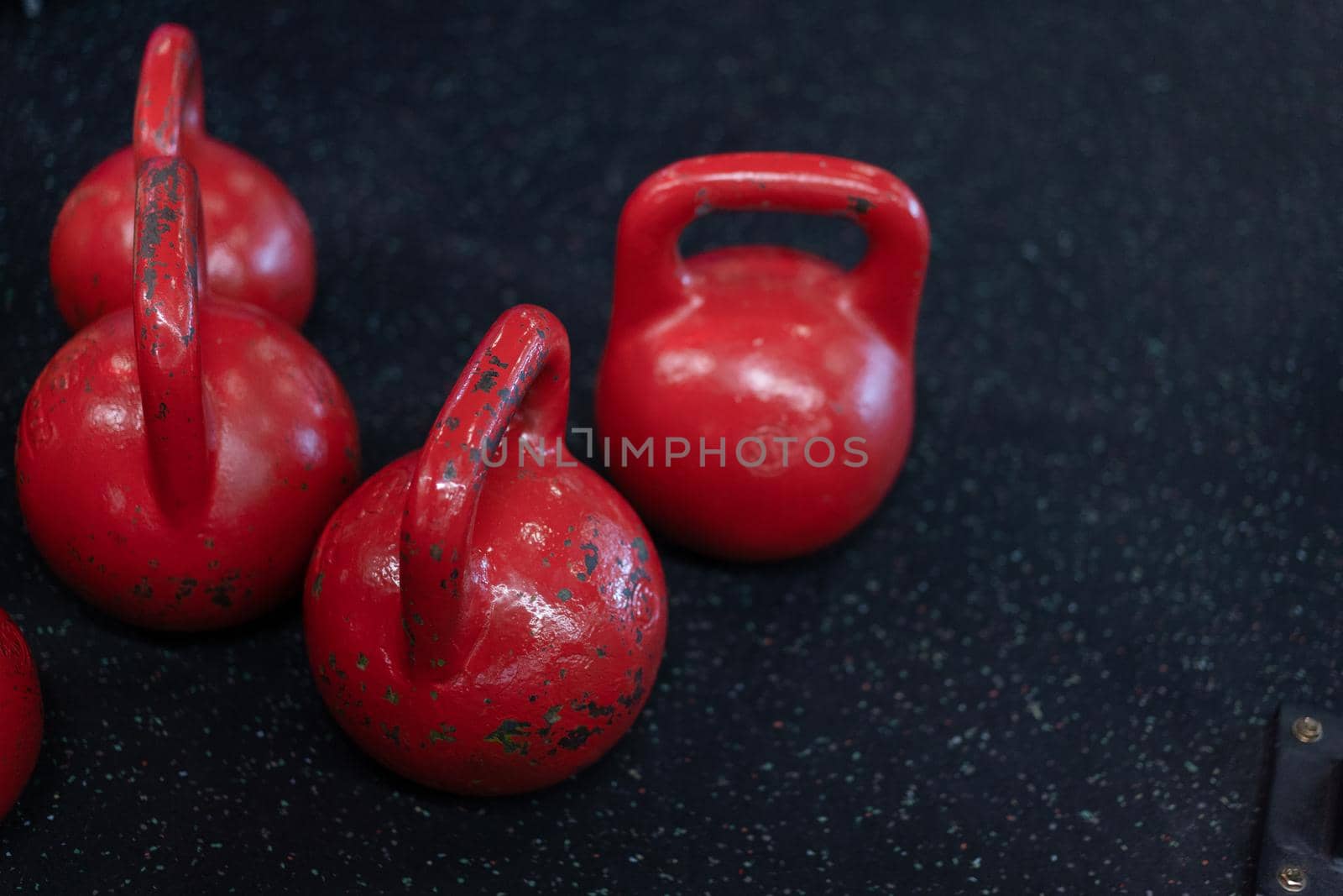 Red old Kettlebell standing black floor with copy space Fitness concept background