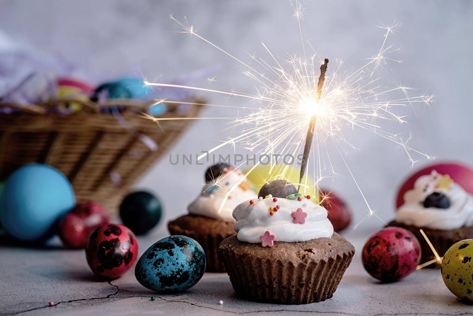 Easter cupcake with a sparkler decorated with colored quail eggs by Desperada