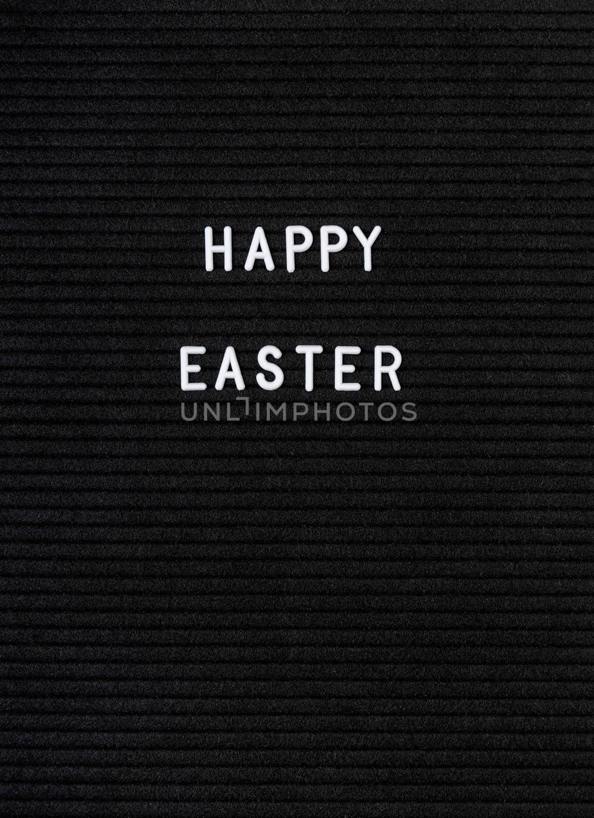 The words Happy Easter on black felt letter board by Desperada