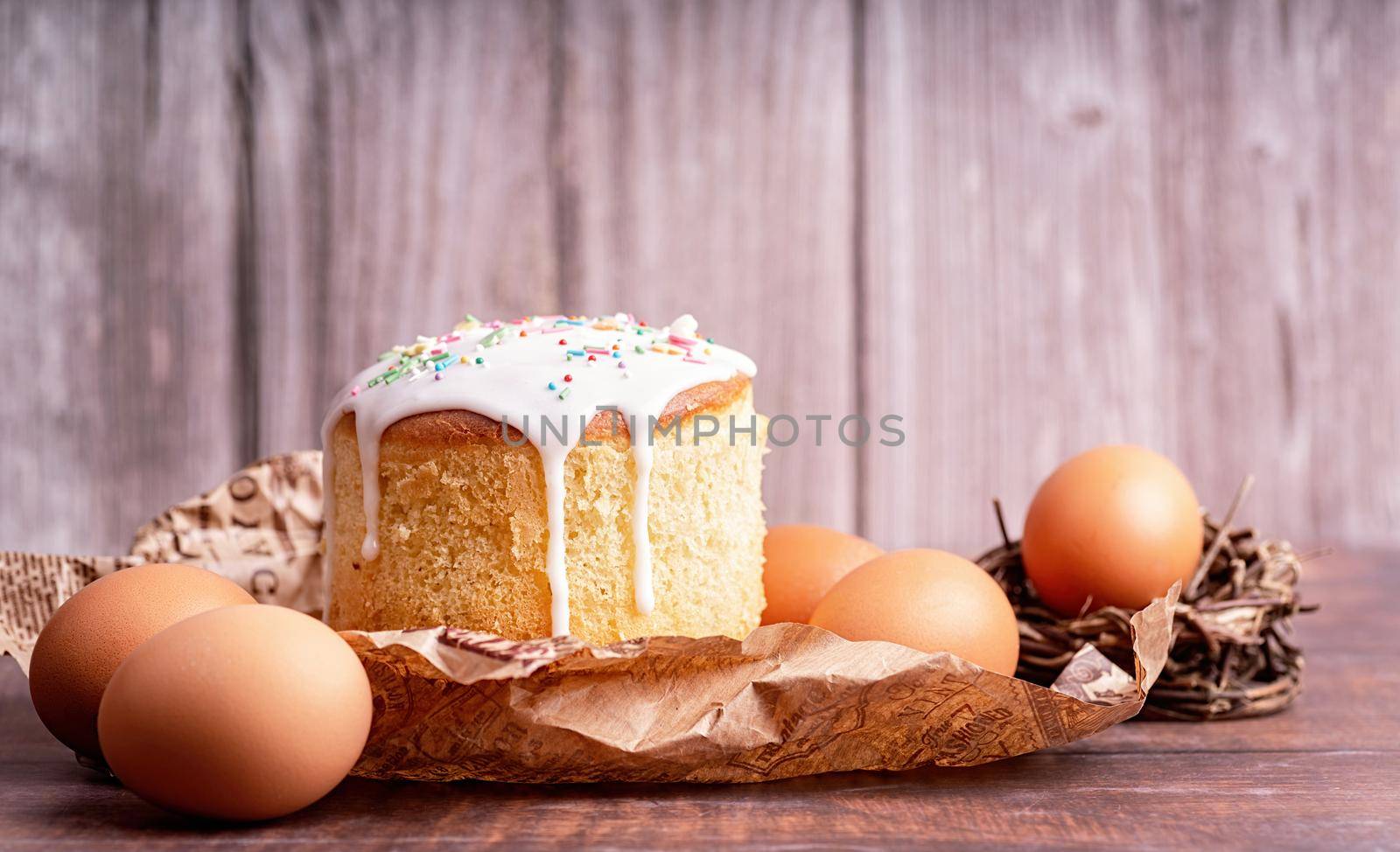 Easter holiday concept. Easter Cake with eggs on wooden background