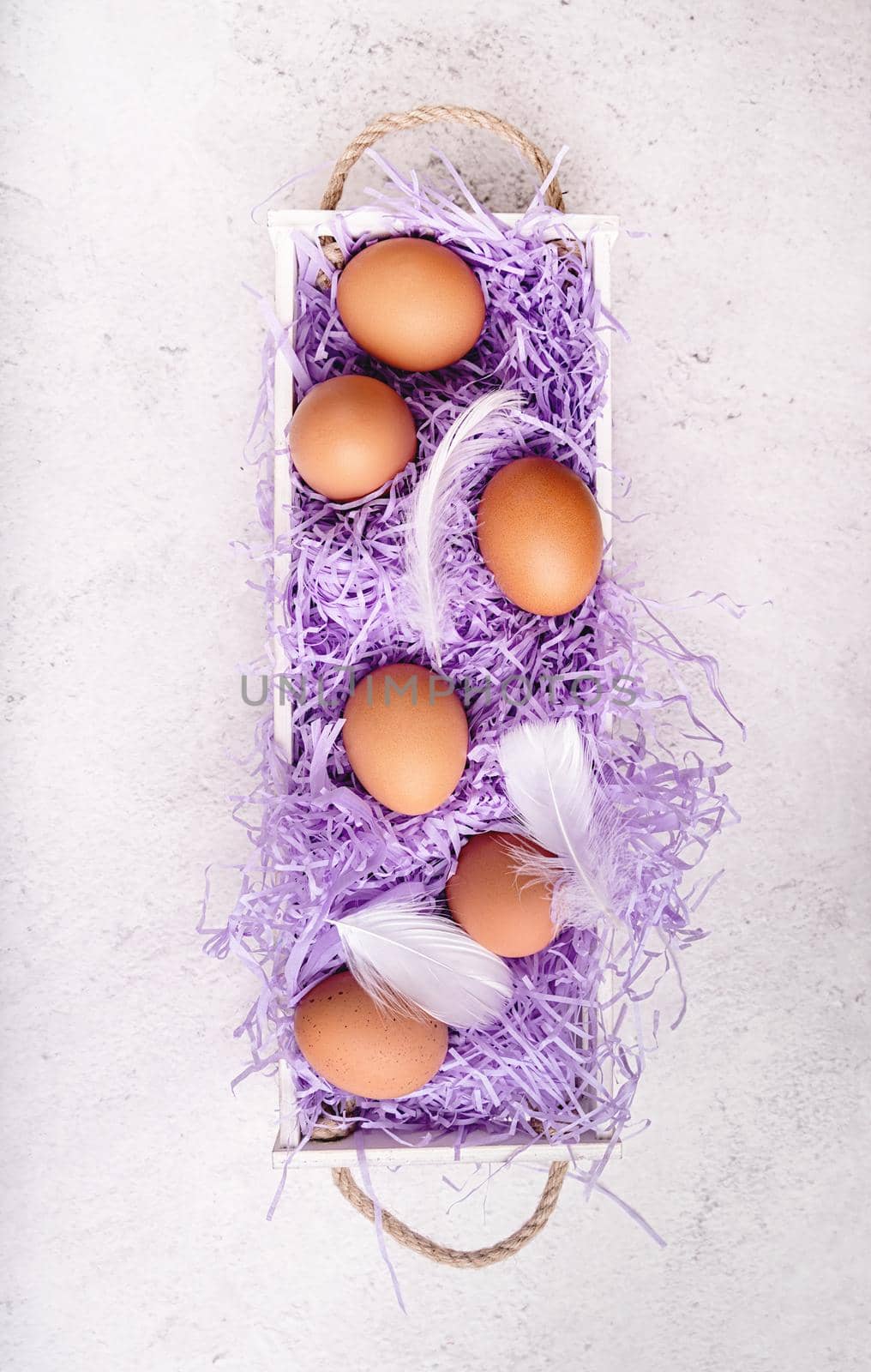 white wooden box with chicken eggs on white marble background top view flat lay by Desperada