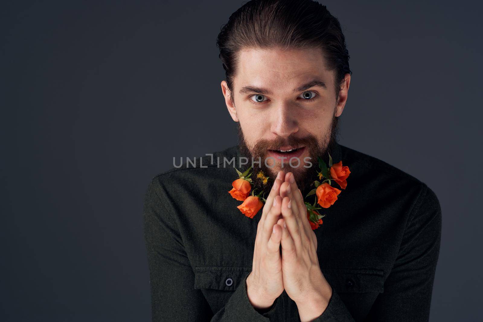 Portrait of a bearded man flowers romance decoration gift dark background by SHOTPRIME