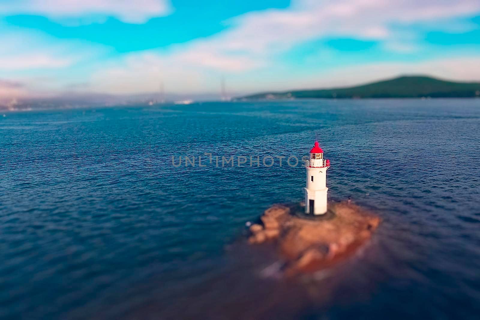 White lighthouse with red roof on Tokarev cat. Vladivostok, Russia