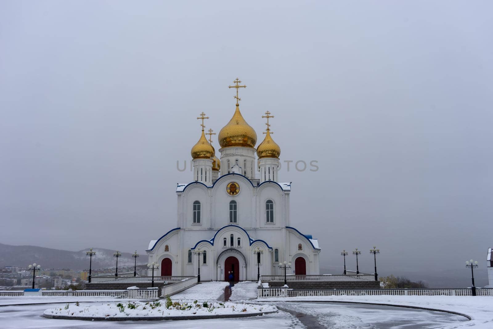 Petropavlovsk-Kamchatsky, Russia. the Church of St. Nicholas against a white snowy sky.