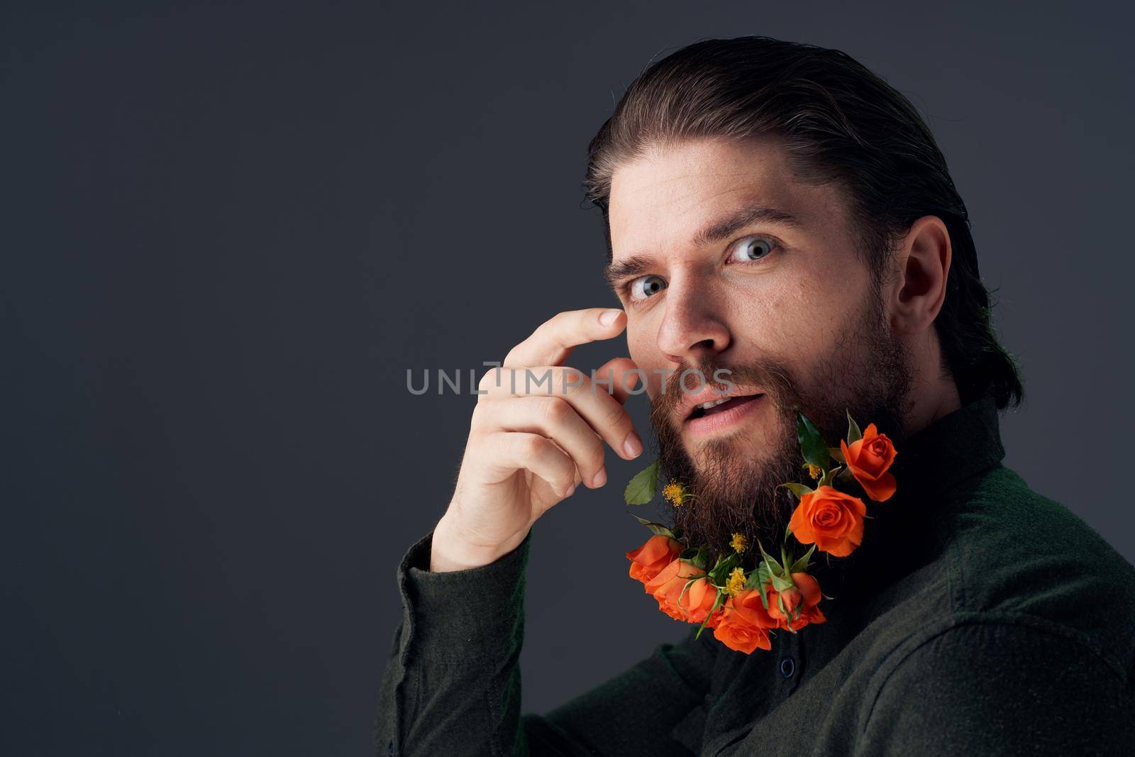 handsome man flowers in a beard decoration romance dark background by SHOTPRIME