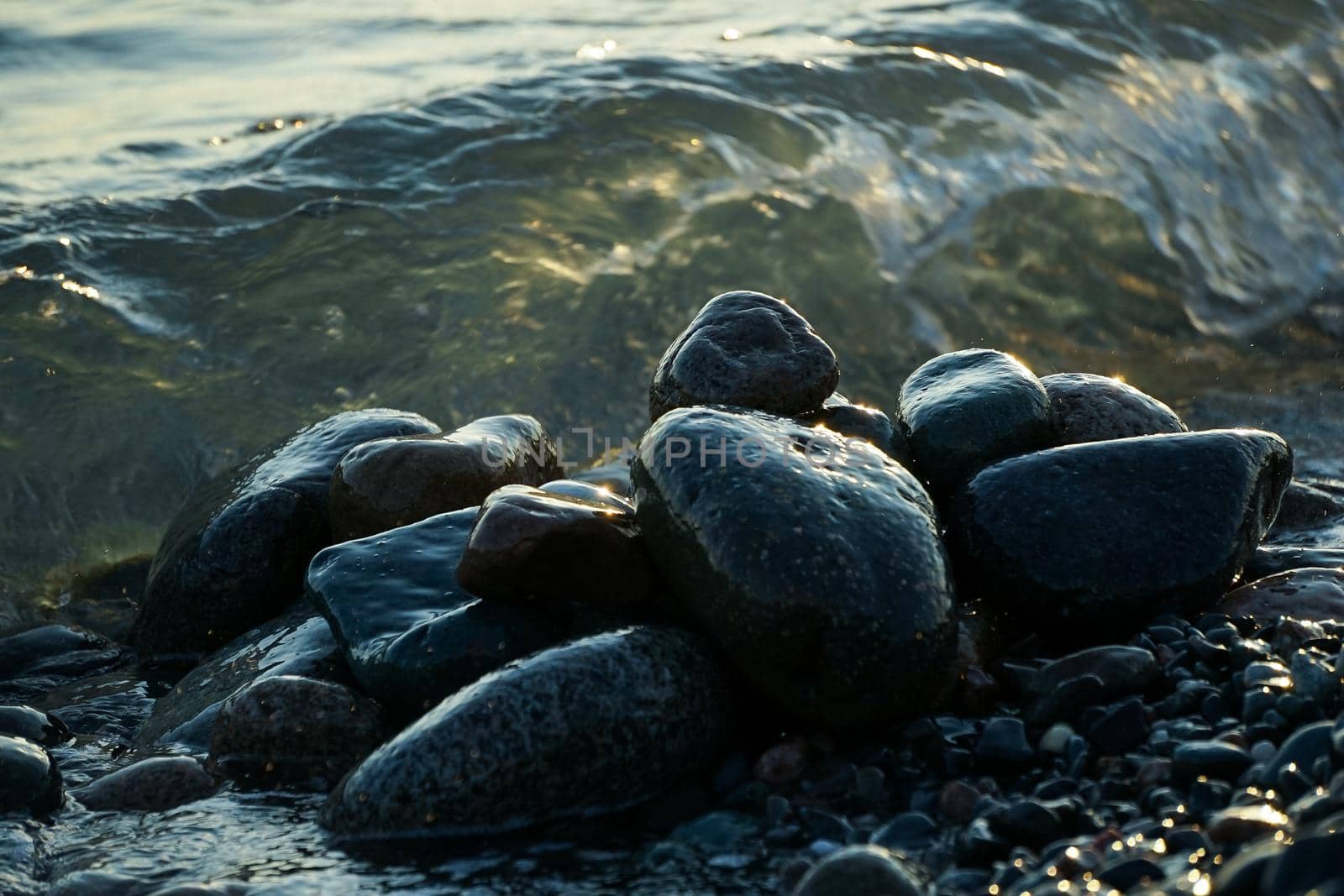 Natural background with large stones and waves.