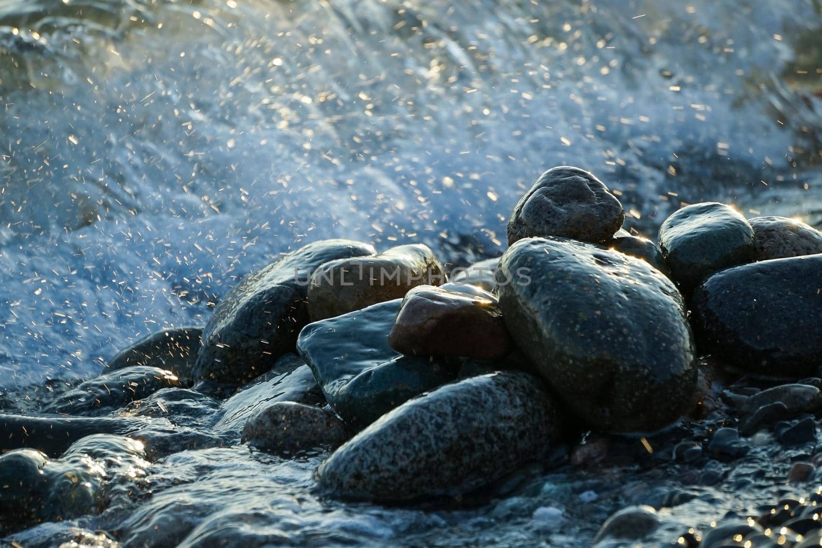 Natural background with large stones and waves.