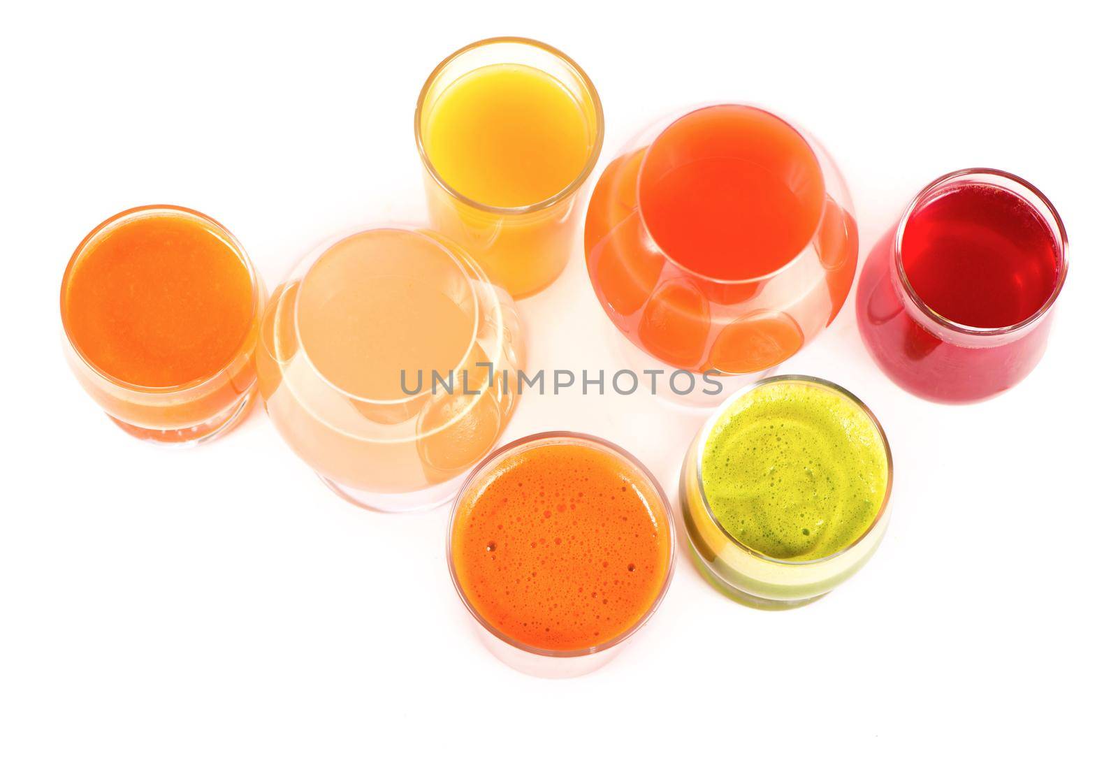 Glasses with fresh organic vegetable and fruit juices isolated on white. Detox diet