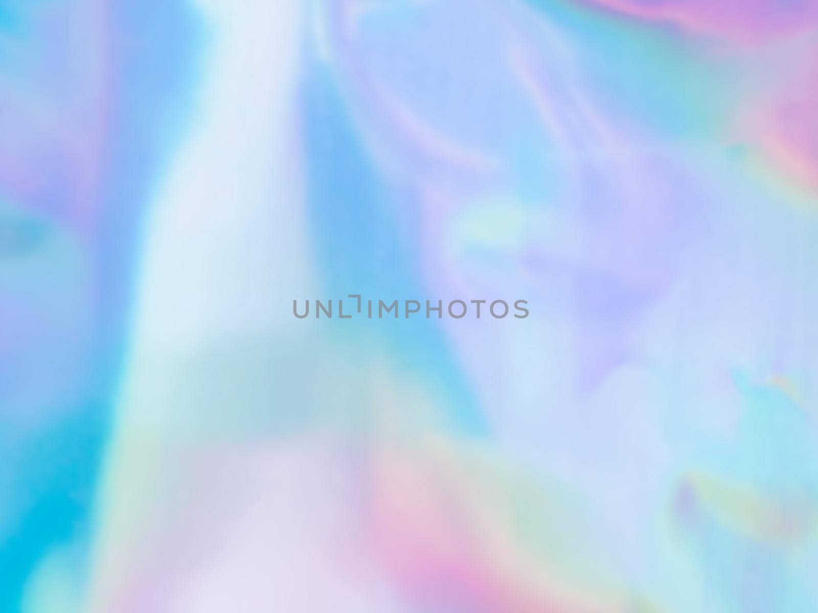Beautiful holographic rainbow abstract background in pastel and neon color design. Real photography shot of holographic foil for creative project - design fashion, cover, book, printing. Copy space