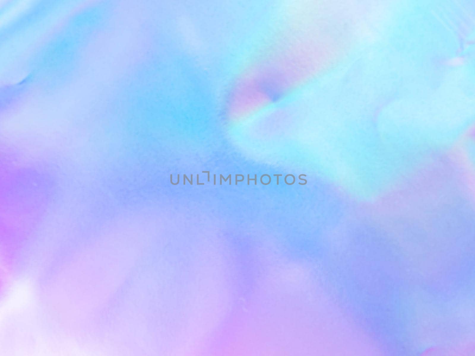 Beautiful holographic rainbow abstract background in pastel and neon color design. Real photography shot of holographic foil for creative project - design fashion, cover, book, printing. Copy space