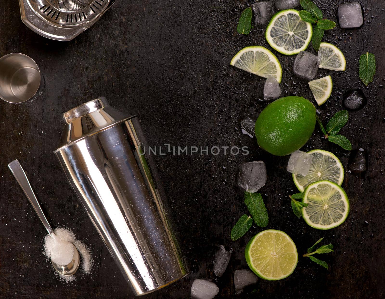 Bar accessories and ingredients for cocktail drink lime, mint, ice by aprilphoto