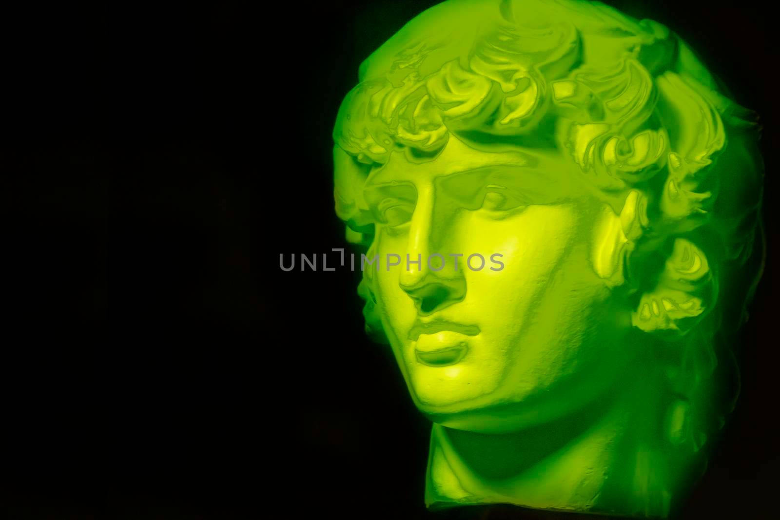A statue. Plaster decorative neon statue of Apollo head.