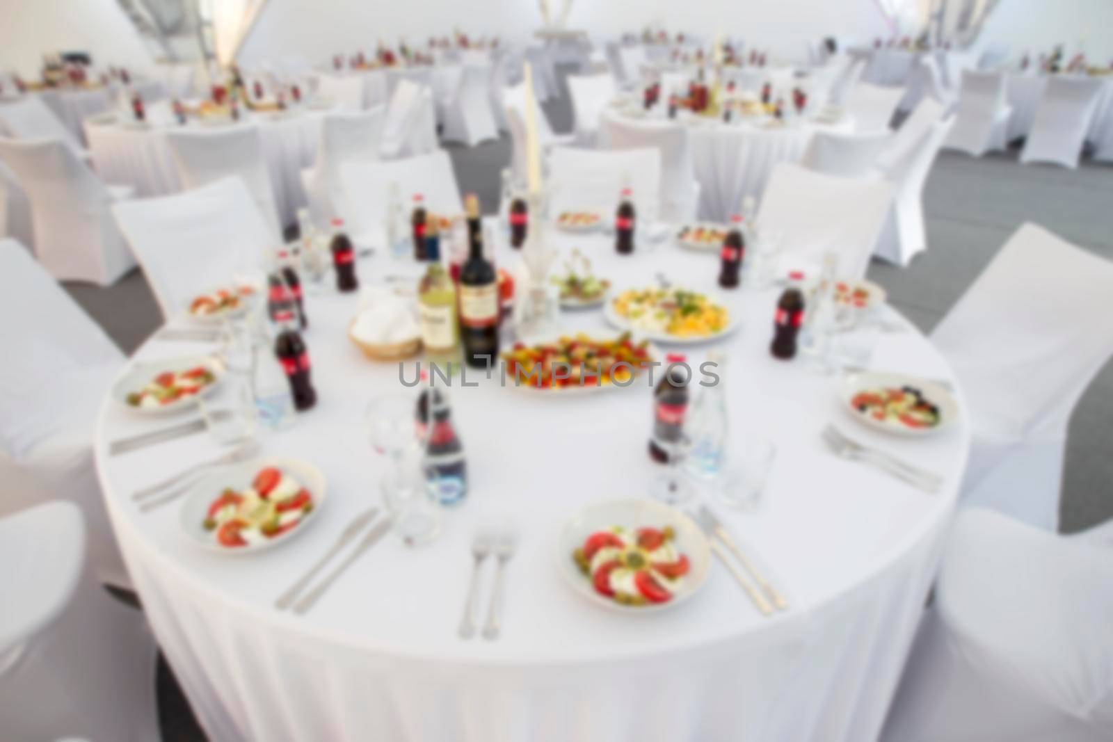 Blurred image of a table set with food.