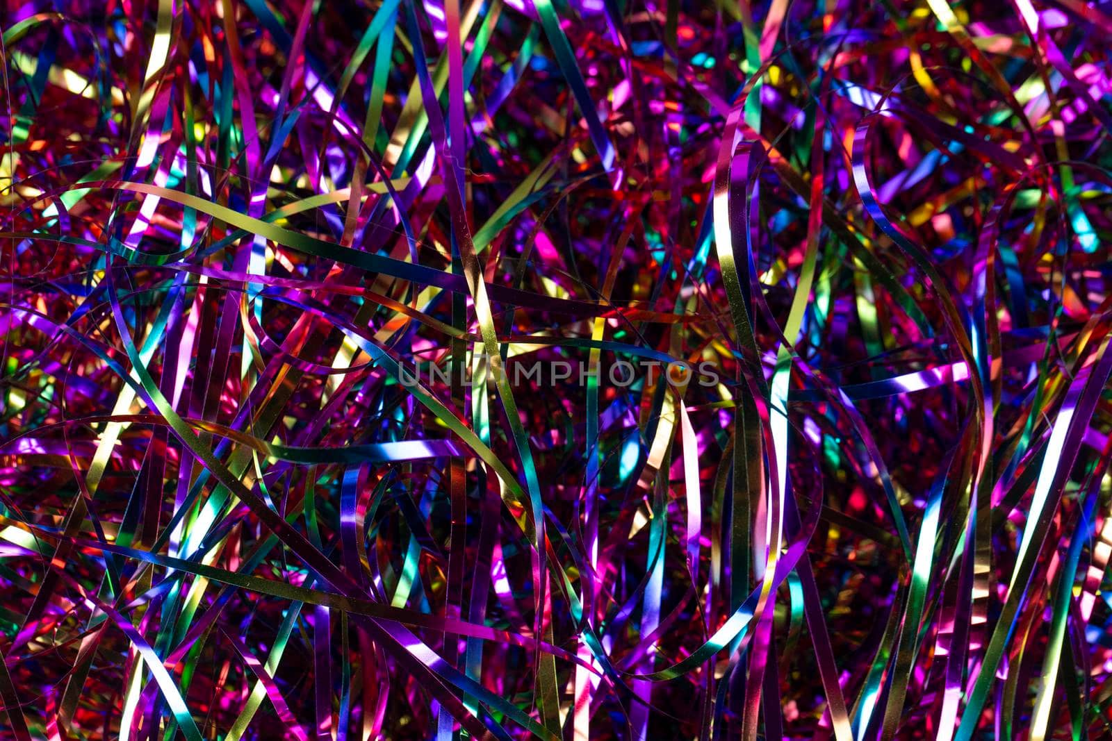Festive background. Lots of multicolored tinsel close-up.