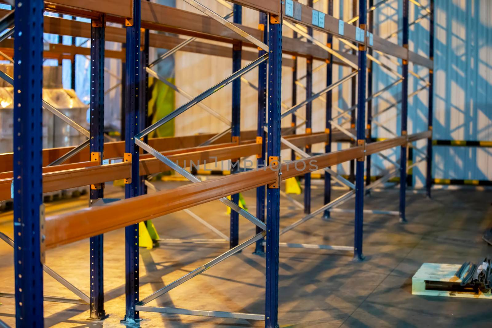 Metal structure of warehouse shelves for storing products.