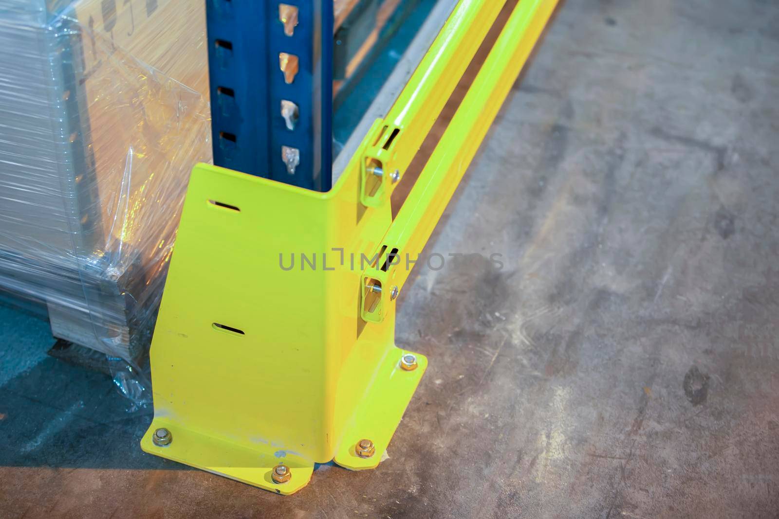 Part of fastening metal structure of warehouse shelves for storing products.