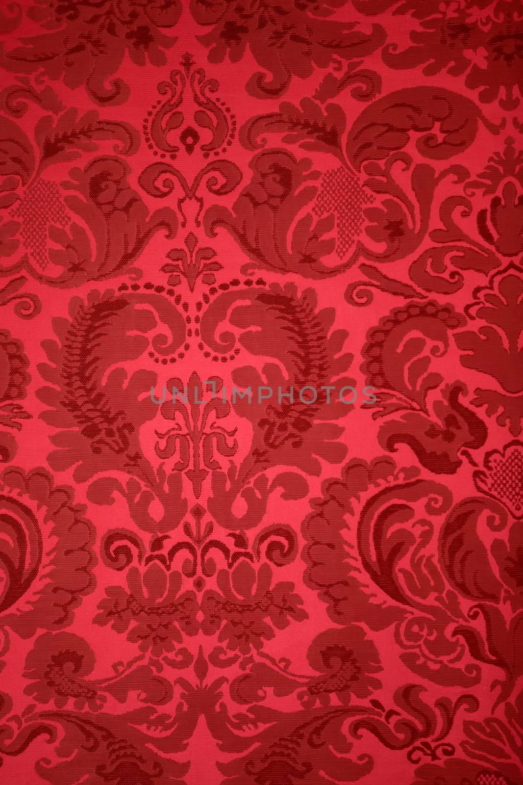 An old pattern on tapestry fabric.Vintage retro background red.