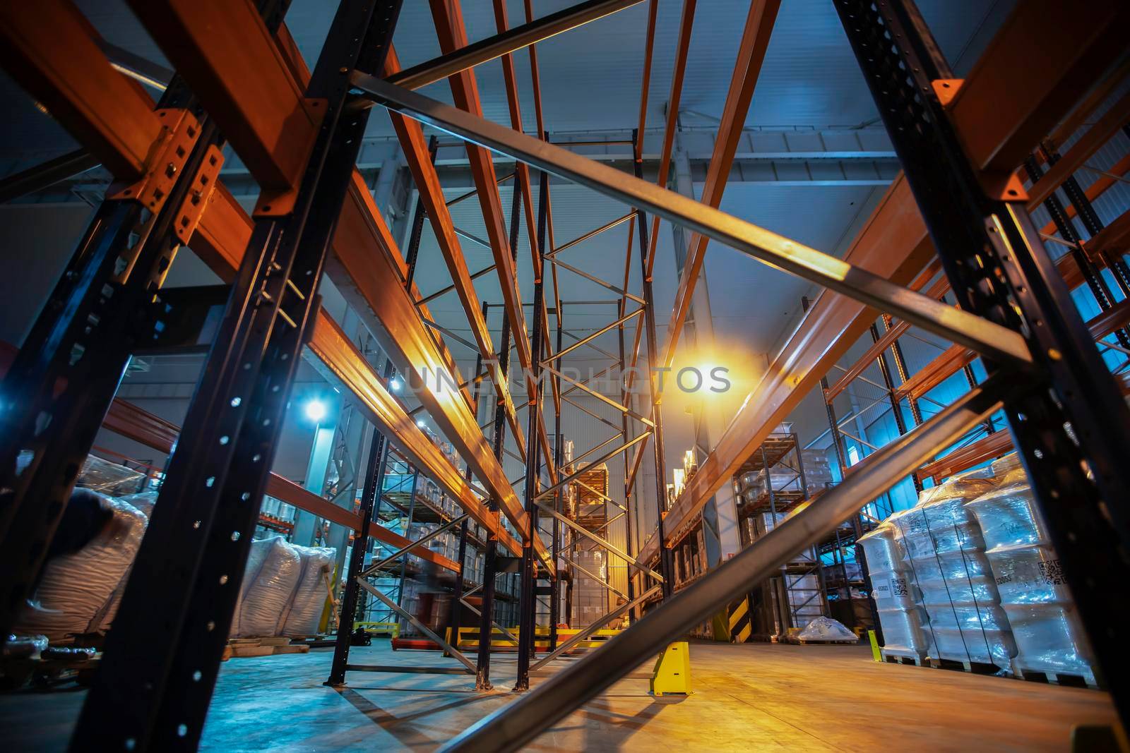 Warehouse premises of a factory or workshop with metal shelves.