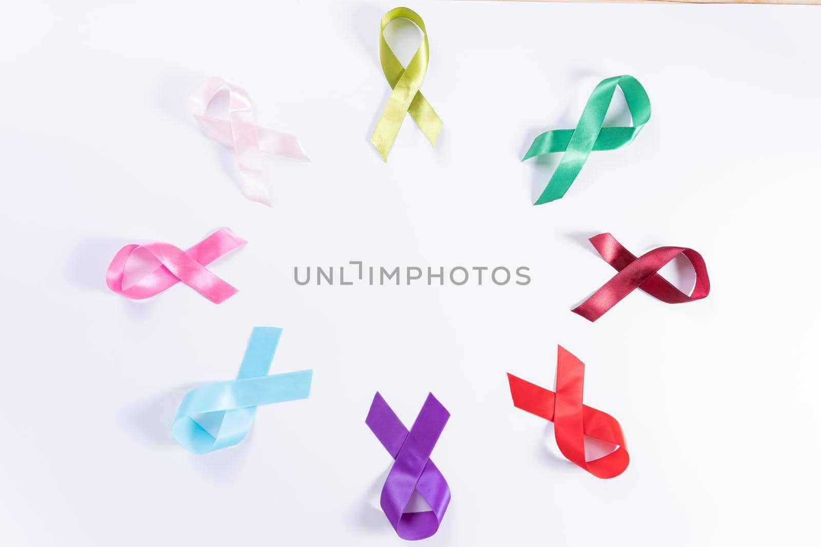 World cancer day, colorful ribbon cancer awareness on with background with copy space for text. Healthcare and medical concept.