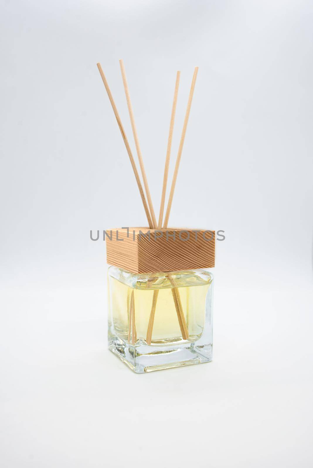A Bottle of Lavender Fragrant Oil Diffuser with Reed Sticks, isolated on white by Nickstock
