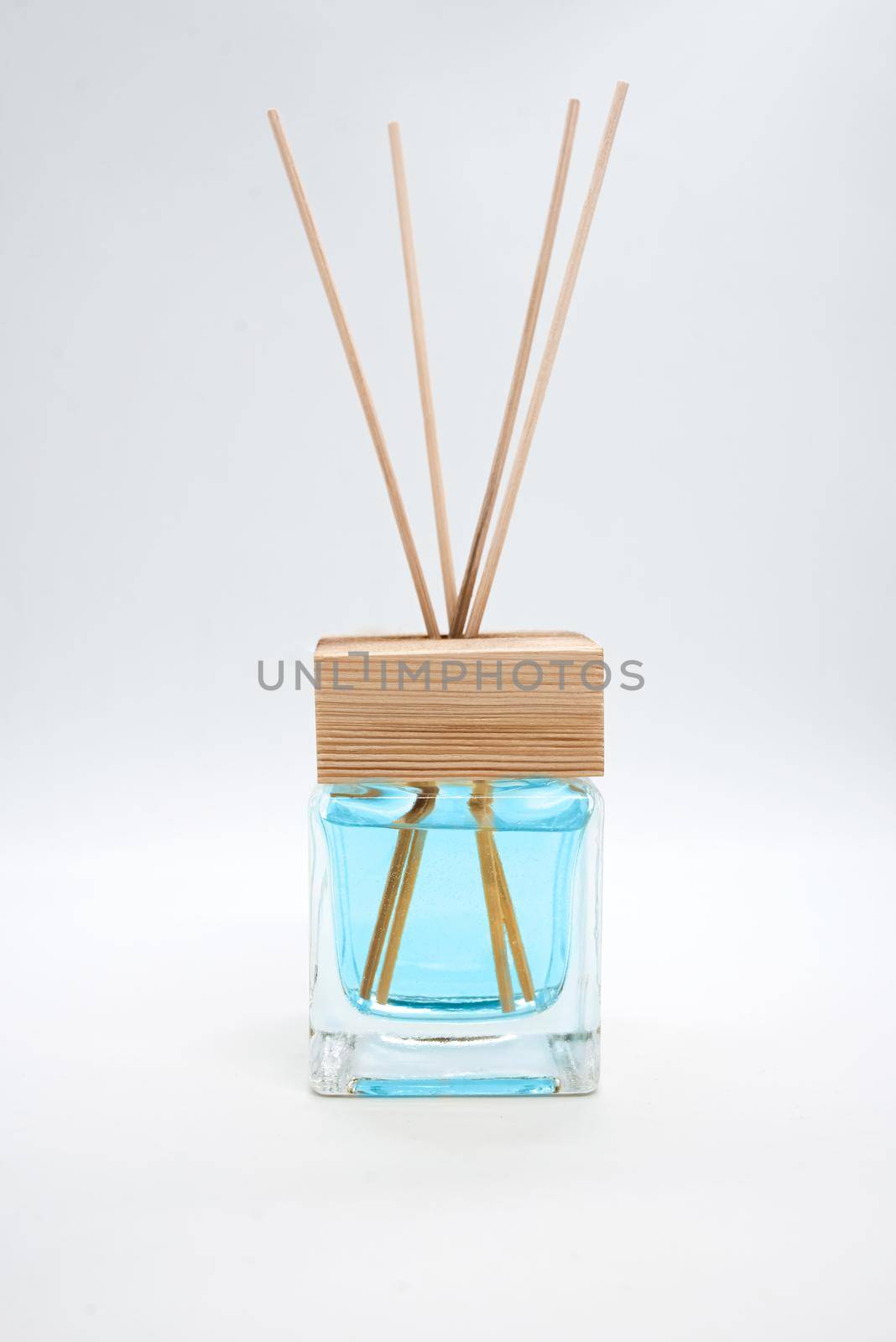 A Bottle of Lavender Fragrant Oil Diffuser with Reed Sticks, isolated on white by Nickstock