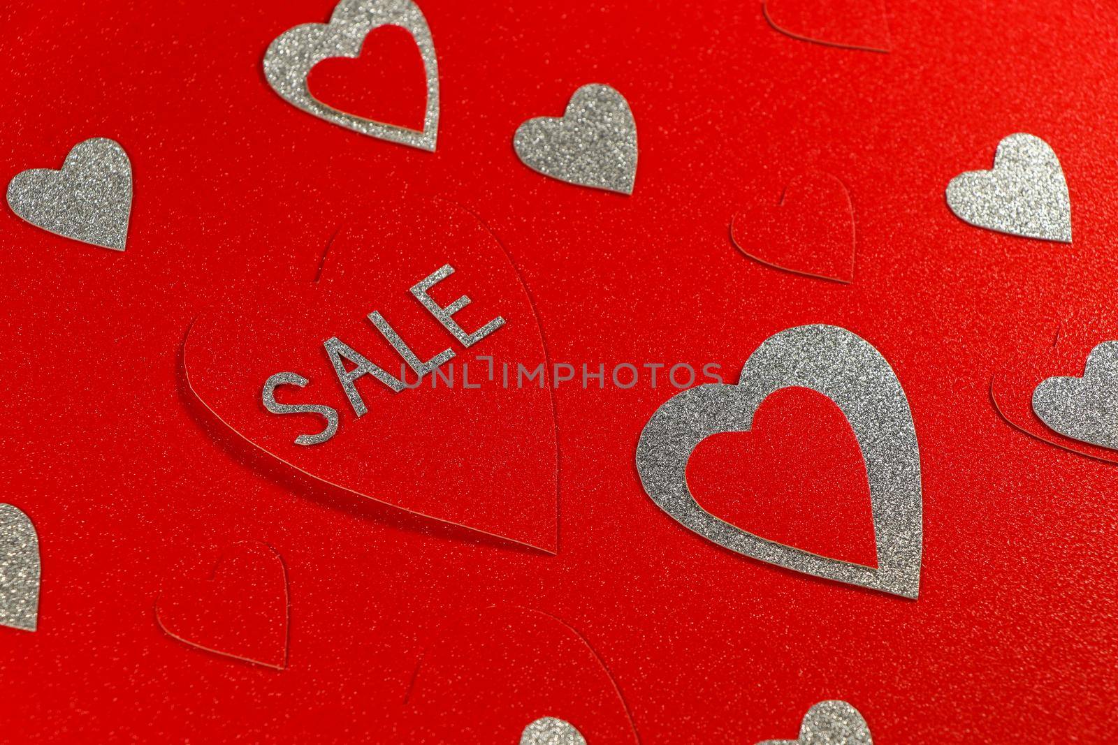 Saint Valentine's day love themed red and silver hearts sale abstract background design