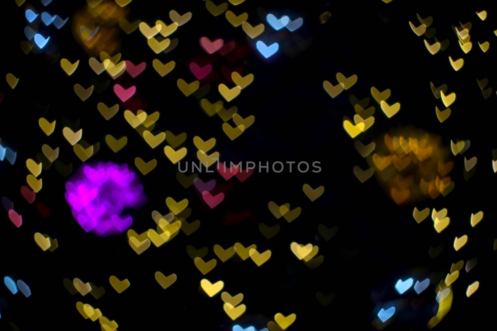 purple ball abstract bokeh and blur heart shape love valentine colorful night light on wall at shopping mall