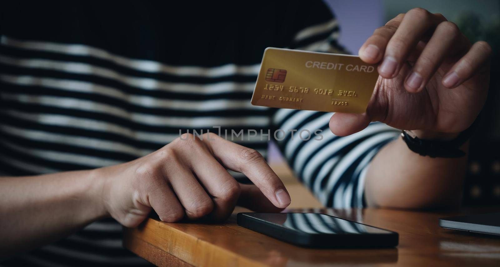 Man holding credit card and typing on smartphone for online shopping and payment makes a purchase on the Internet, Online payment, Business financial and technology