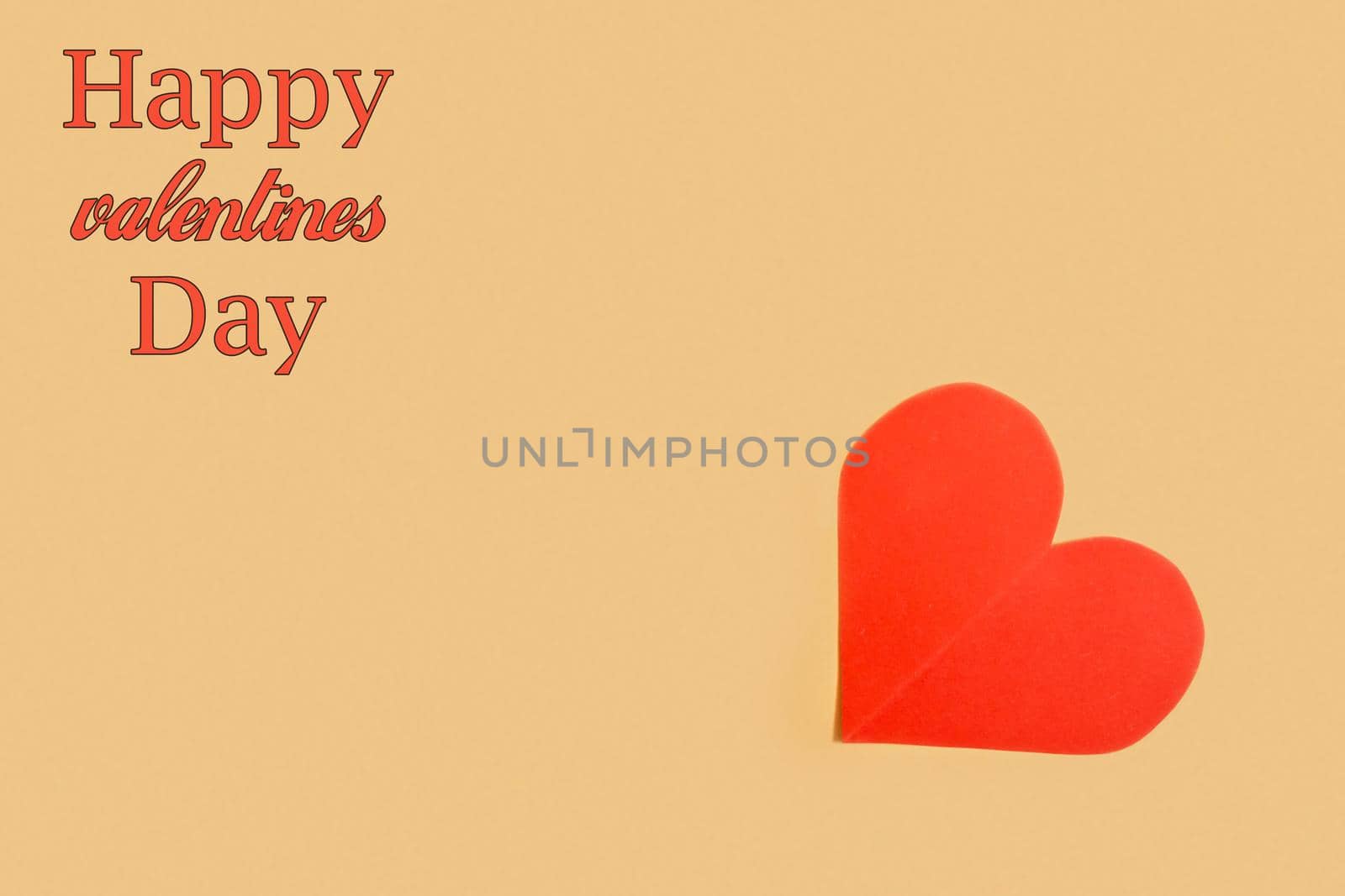 Paper heart on yellow background with the inscription Happy Valentine's Day.Abstract background with paper cut shapes.Saint Valentine,mother's day.Copy space.