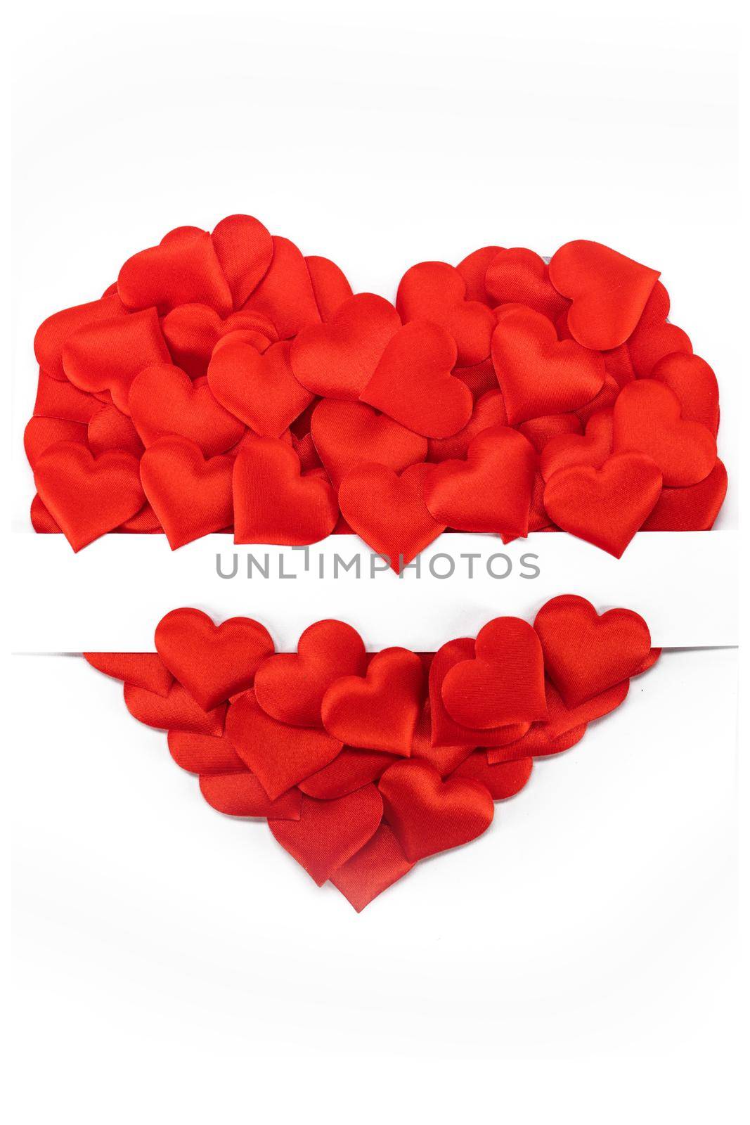 Valentine's day many red silk hearts isolated on white background, love concept