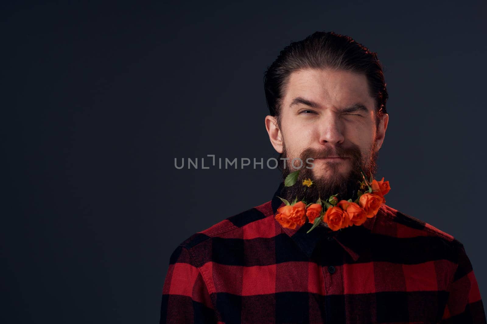 Cute bearded man flowers decoration plaid shirt emotions. High quality photo