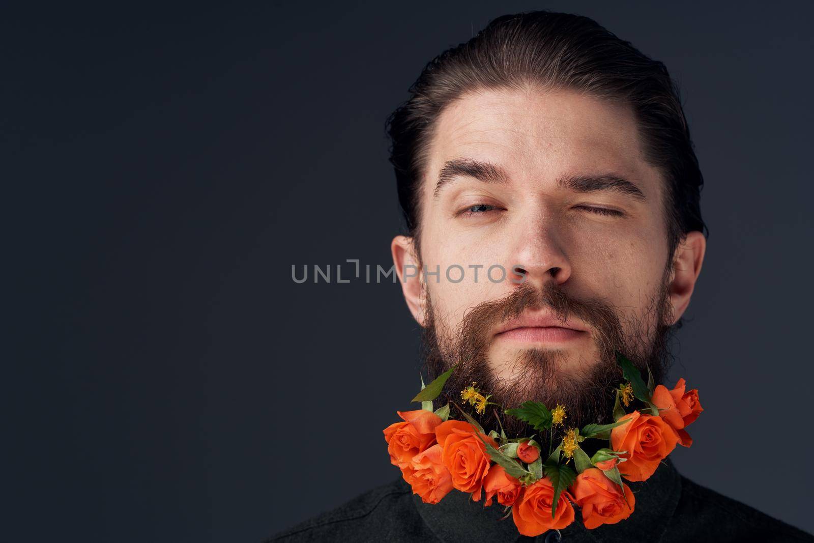 Cute man and flowers in the city romance decoration black background. High quality photo