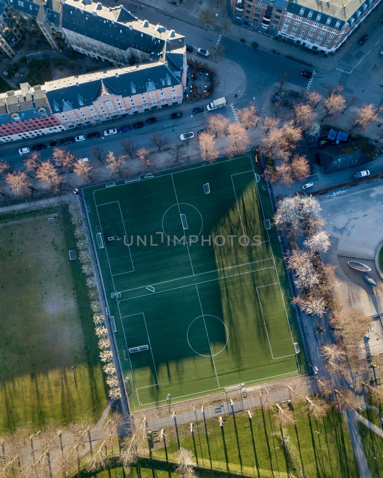 Copenhagen, Denmark - April 17, 2020: Top down aerial drone view of a two soccer fields in Norrebro district