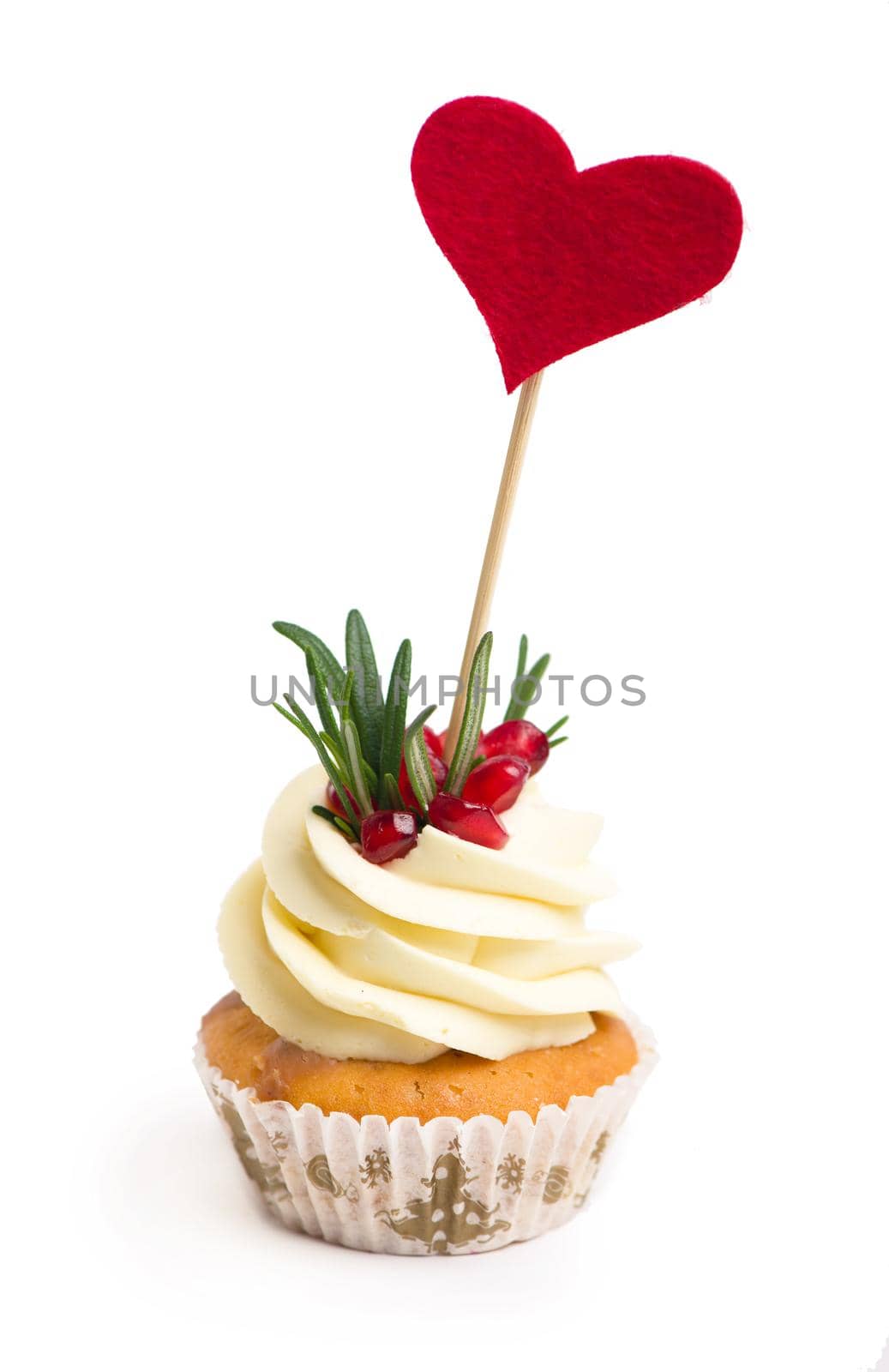 Sweet confession. Heart on top of cupcake valentine on white background. by aprilphoto