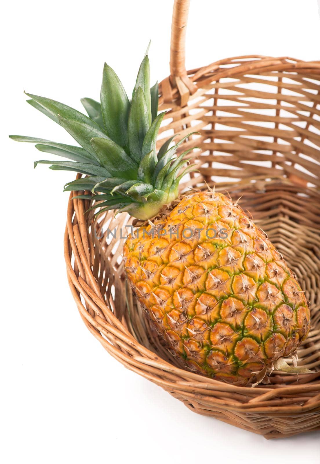 Ripe whole pineapple isolated on the white by aprilphoto