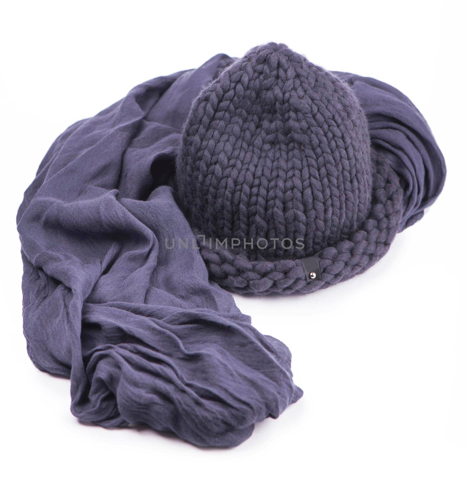 Gray cap and warm scarf on a white background by aprilphoto