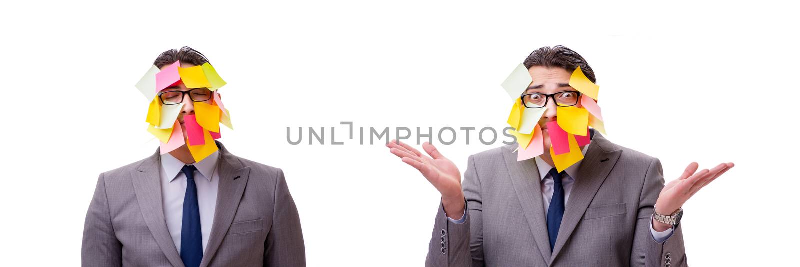 Businessman with many reminders isolated on white
