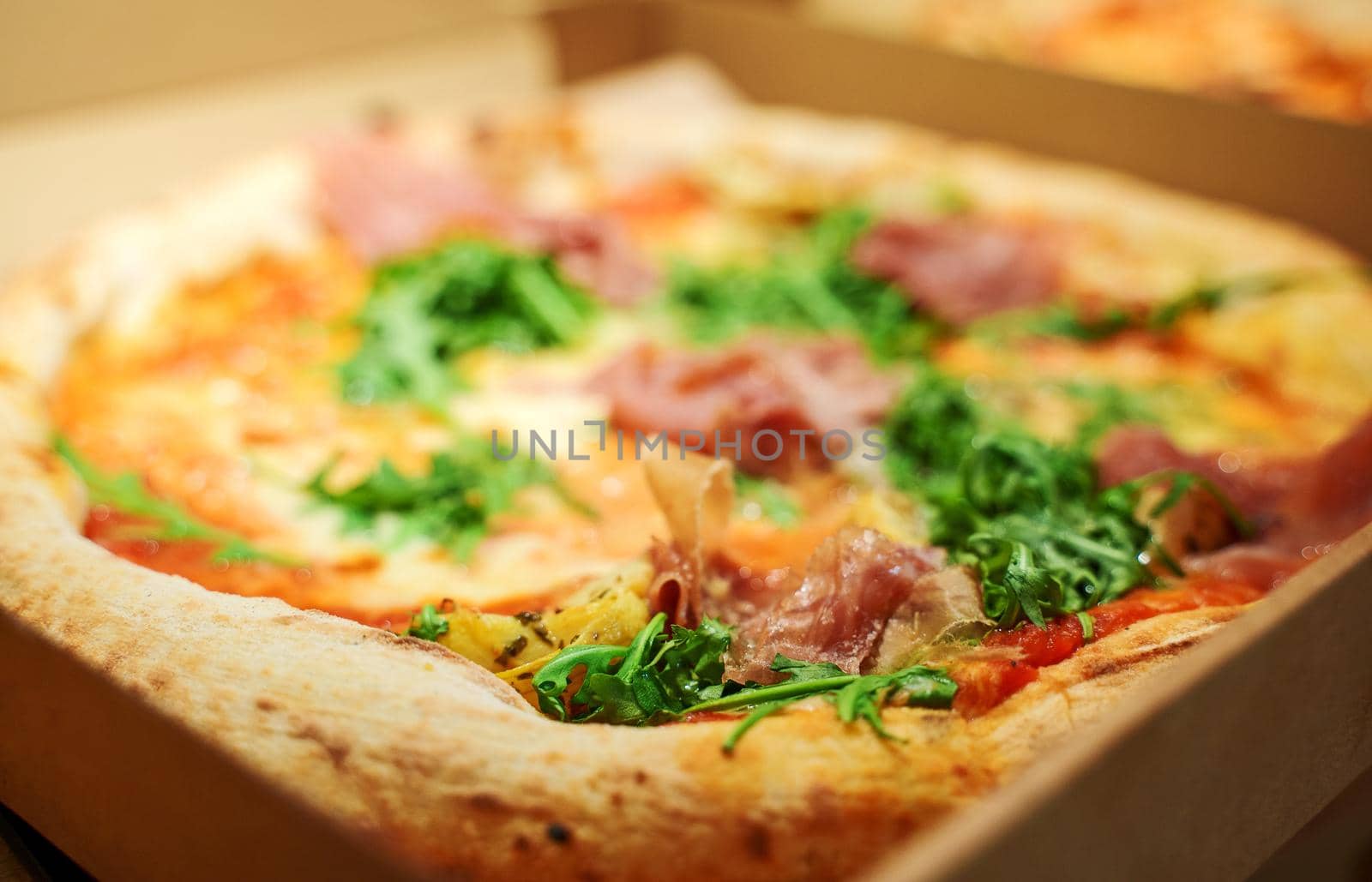 Freshly baked ordered pizza in a box. by dmitrimaruta